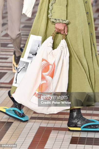 Model, bag detail, walks the runway during the Acne Studios Womenswear Spring Summer 2019 show during the Paris Fashion Week on July 1, 2018 in...