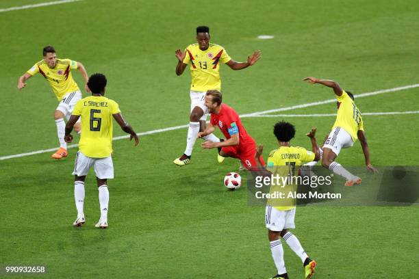 Harry Kane of England is fouled by Jefferson Lerma of Colombia outside Colombia penalty area during the 2018 FIFA World Cup Russia Round of 16 match...