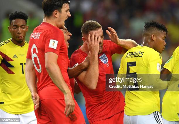 Jordan Henderson of England reacts after Wilmar Barrios of Colombia headbutts him during the 2018 FIFA World Cup Russia Round of 16 match between...