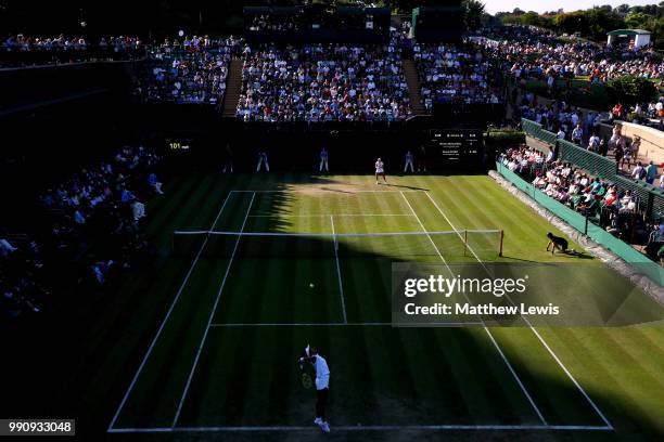 Naomi Osaka of Japan serves against Monica Niculescu of Romania during their Ladies' Singles first round match on day two of the Wimbledon Lawn...