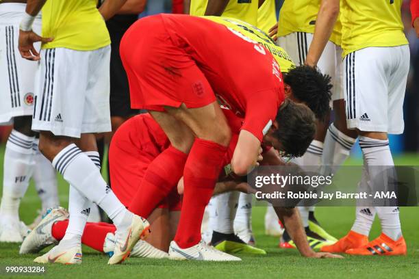 Jordan Henderson of England reacts following a clash with Wilmar Barrios of Colombia during the 2018 FIFA World Cup Russia Round of 16 match between...