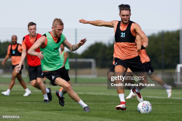 Oliver McBurnie against Matt Grimes in action during the Swansea City Training Session at The Fairwood Training Ground on July 03, 2018 in Swansea,...