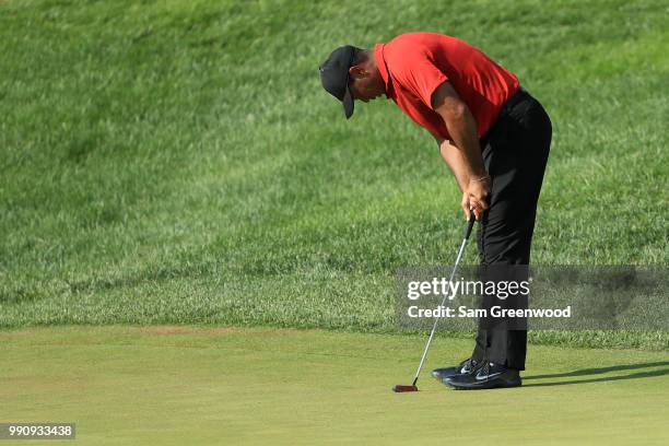 Tiger Woods reacts to a putt on the 17th green during the final round of the Quicken Loans National at TPC Potomac on July 1, 2018 in Potomac,...