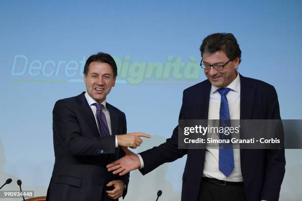 Prime Minister of Italy Giuseppe Conte and the Undersecretary to the Presidency Giancarlo Giorgetti attend the presentation to the press of the...