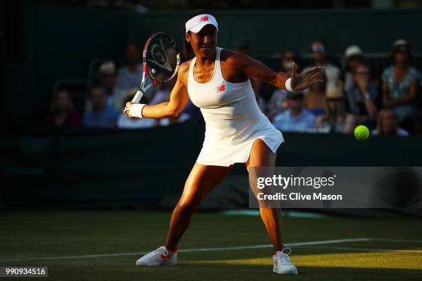 Heather Watson of Great Britain returns against Kirsten Flipkens of Belgium during their Ladies' Singles first round match on day two of the...