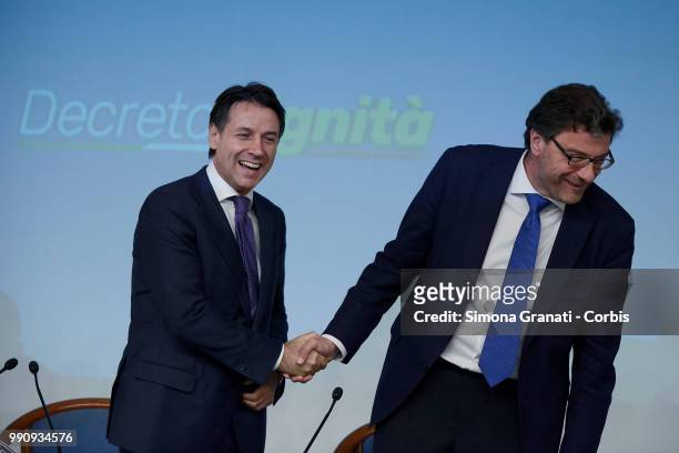Prime Minister of Italy Giuseppe Conte and the Undersecretary to the Presidency Giancarlo Giorgetti attend the presentation to the press of the...
