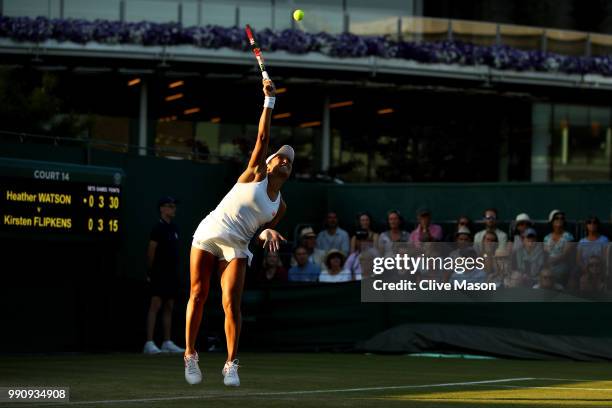 Heather Watson of Great Britain serves against Kirsten Flipkens of Belgium during their Ladies' Singles first round match on day two of the Wimbledon...