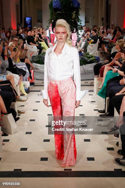 Model walks the runway at the Anja Gockel show during the Berlin Fashion Week Spring/Summer 2019 at Hotel Adlon on July 3, 2018 in Berlin, Germany.
