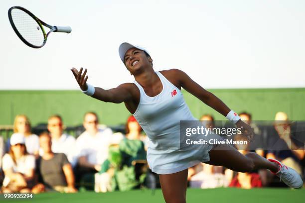 Heather Watson of Great Britain accidently throws her racket during her Ladies' Singles first round match against Kirsten Flipkens of Belgium on day...