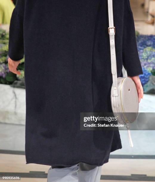 Model, bag detail, walks the runway at the Anja Gockel show during the Berlin Fashion Week Spring/Summer 2019 at Hotel Adlon on July 3, 2018 in...