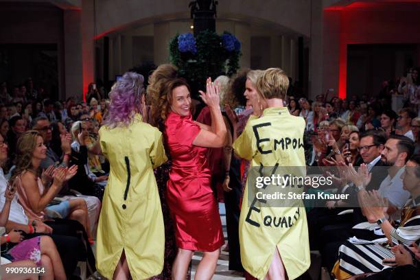 Designer Anja Gockel ackowledges the applause of the audience during her show during the Berlin Fashion Week Spring/Summer 2019 at Hotel Adlon on...