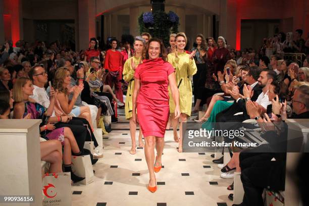 Designer Anja Gockel ackowledges the applause of the audience during her show during the Berlin Fashion Week Spring/Summer 2019 at Hotel Adlon on...