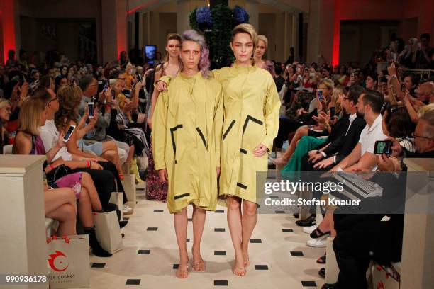 Models walk the runway at the Anja Gockel show during the Berlin Fashion Week Spring/Summer 2019 at Hotel Adlon on July 3, 2018 in Berlin, Germany.