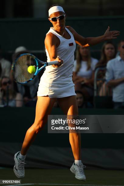 Kirsten Flipkens of Belgium returns against Heather Watson of Great Britain during their Ladies' Singles first round match on day two of the...