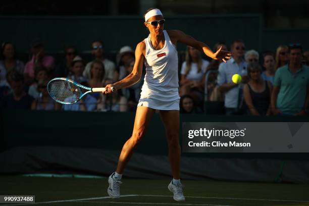 Kirsten Flipkens of Belgium returns against Heather Watson of Great Britain during their Ladies' Singles first round match on day two of the...