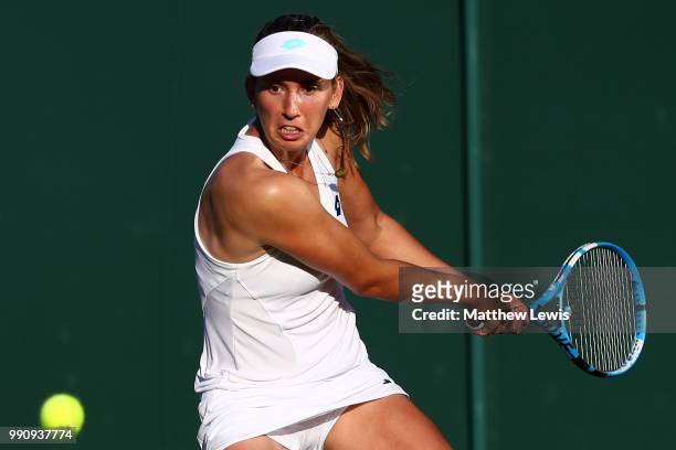 Elise Mertens of Belgium returns against Danielle Collins of The United States on day two of the Wimbledon Lawn Tennis Championships at All England...