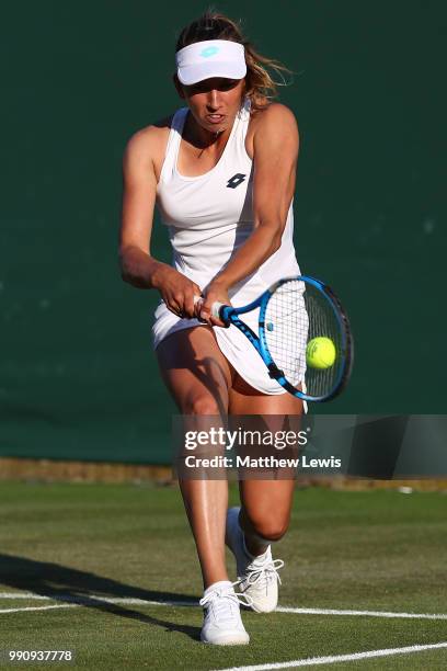 Elise Mertens of Belgium returns against Danielle Collins of The United States on day two of the Wimbledon Lawn Tennis Championships at All England...