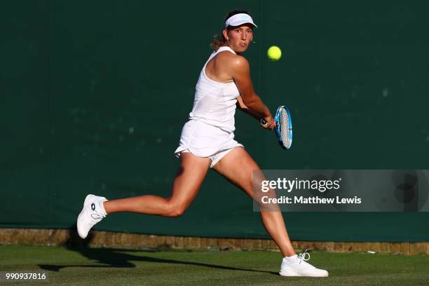 Elise Mertens of Belgium returns against Danielle Collins of The United States on day two of the Wimbledon Lawn Tennis Championships at All England...