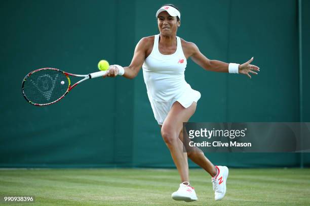 Heather Watson of Great Britain returns against Kirsten Flipkens of Belgium during their Ladies' Singles first round match on day two of the...