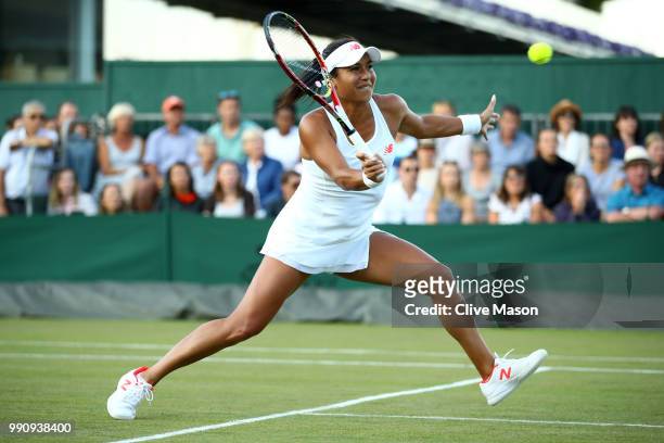 Heather Watson of Great Britain returns against Kirsten Flipkens of Belgium during their Ladies' Singles first round match on day two of the...