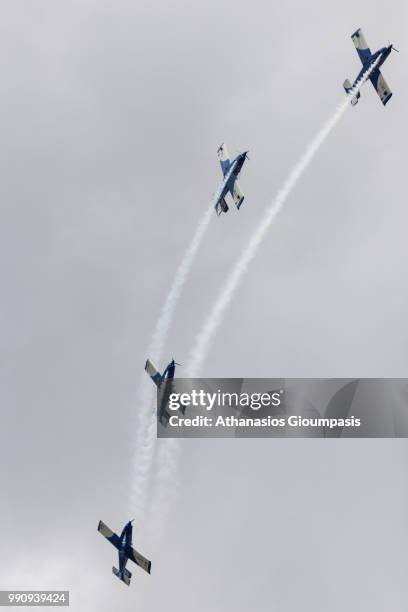 Four FlyLatino FL-100RGs aircrafts of the Italian Blu Circe Team perform an aerobatic display during the Kavala Air Sea Show on June 30, 2018 in...