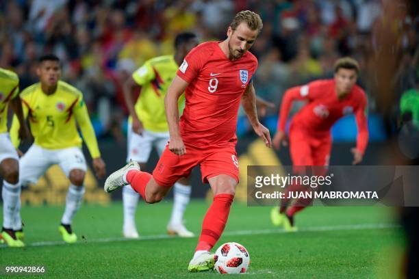 England's forward Harry Kane shoots a penalty kick to score a goal during the Russia 2018 World Cup round of 16 football match between Colombia and...