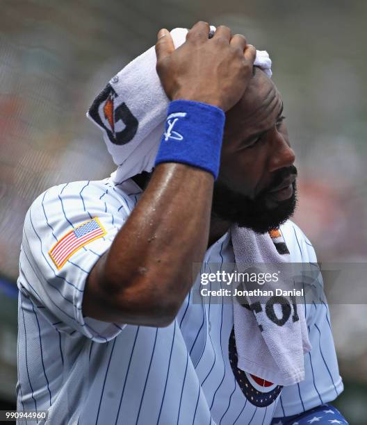 Jason Heyward of the Chicago Cubs towels off in the dugout during a game against the Detroit Tigers at Wrigley Field on July 3, 2018 in Chicago,...