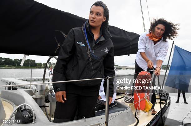 French skipper Marie Tabarly looks on, on the deck of the Pen-Duick VI before the start of his sailing project "Elemen'Terre project" in Lorient,...