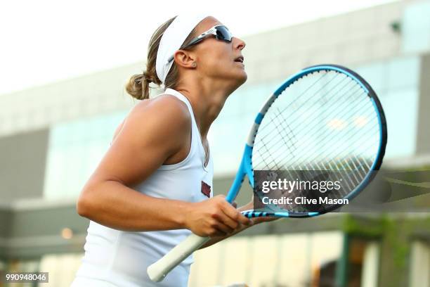 Kirsten Flipkens of Belgium reacts during her Ladies' Singles first round match against Heather Watson of Great Britain on day two of the Wimbledon...