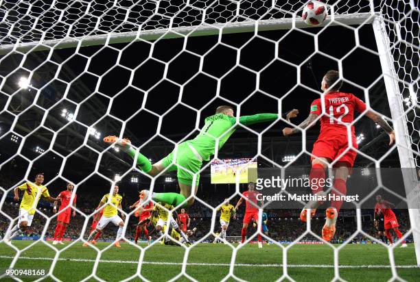 Yerry Mina of Colombia scores past Jordan Pickford of England his team's first goal during the 2018 FIFA World Cup Russia Round of 16 match between...