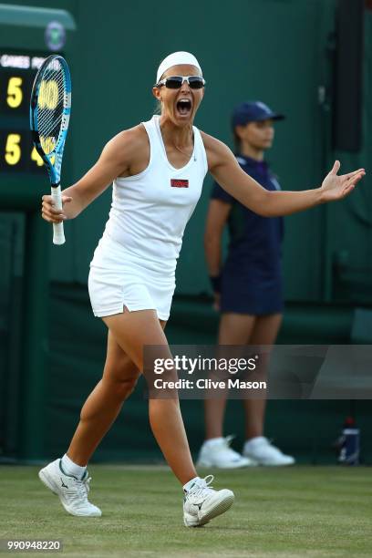 Kirsten Flipkens of Belgium celebrates her victory over Heather Watson of Great Britain during their Ladies' Singles first round match on day two of...