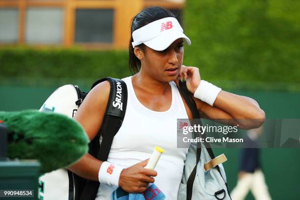 Heather Watson of Great Britain appears dejected after her Ladies' Singles first round match against Kirsten Flipkens of Belgium on day two of the...