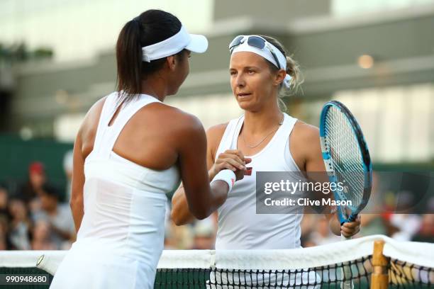 Kirsten Flipkens of Belgium shakes hands with Heather Watson of Great Britain after their Ladies' Singles first round match on day two of the...