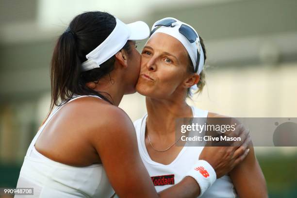 Kirsten Flipkens of Belgium shakes hands with Heather Watson of Great Britain after their Ladies' Singles first round match on day two of the...