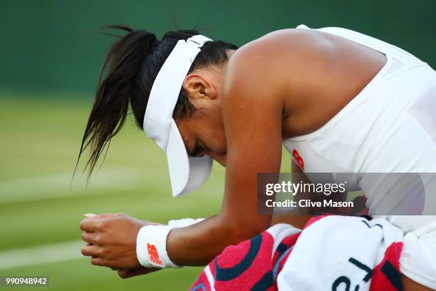 Heather Watson of Great Britain appears dejected after her Ladies' Singles first round match against Kirsten Flipkens of Belgium on day two of the...