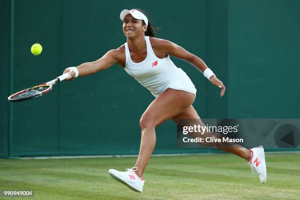 Heather Watson of Great Britain returns against Kirsten Flipkens of Belgium during their Ladies' Singles first round match on day two of the...