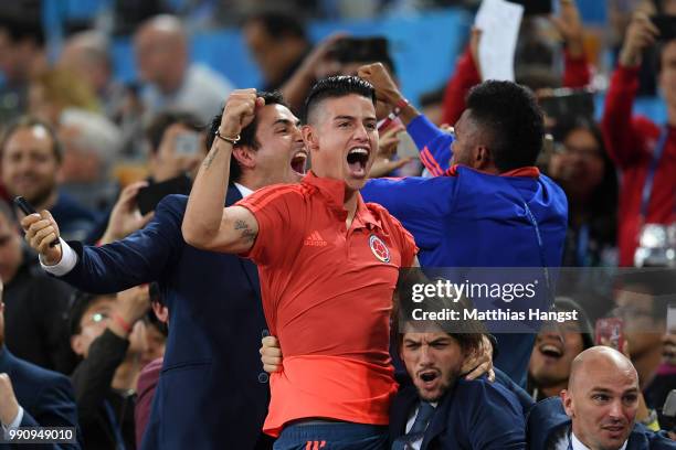 James Rodriguez of Colombia celebrates from the crowd after teammate Yerry Mina scores their team's first goal during the 2018 FIFA World Cup Russia...