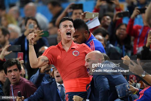 James Rodriguez of Colombia celebrates from the crowd after teammate Yerry Mina scores their team's first goal during the 2018 FIFA World Cup Russia...