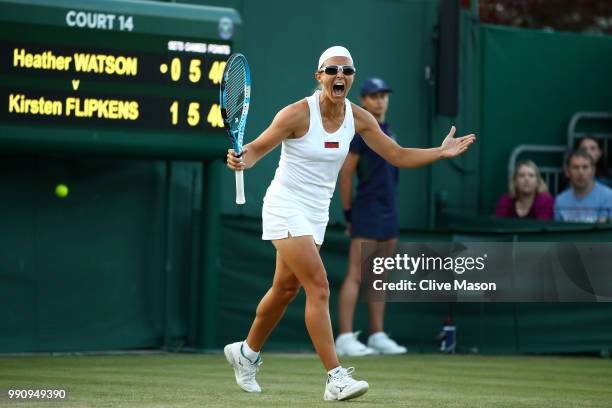 Kirsten Flipkens of Belgium celebrates match point against Heather Watson of Great Britain during their Ladies' Singles first round match on day two...