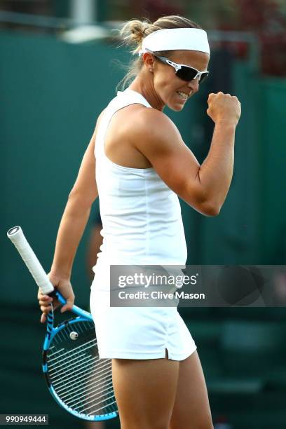 Kirsten Flipkens of Belgium celebrates a point against Heather Watson of Great Britain after their Ladies' Singles first round match on day two of...