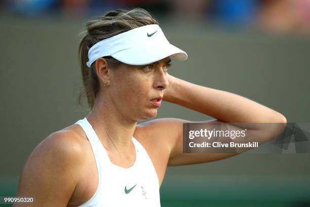 Maria Sharapova of Russia looks on during her Ladies' Singles first round match against Vitalia Diatchenko of Russia on day two of the Wimbledon Lawn...