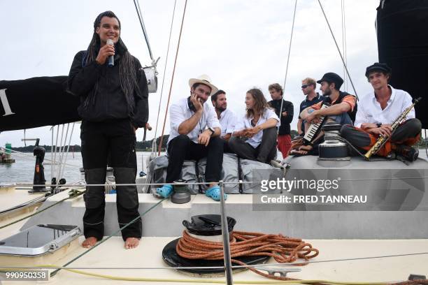 French skipper Marie Tabarly stands with her team on the deck of the Pen-Duick VI before the start of her sailing project "Elemen'Terre project" in...