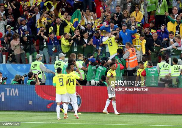 Yerry Mina of Colombia celebrates with fans after scoring his team's first goal during the 2018 FIFA World Cup Russia Round of 16 match between...