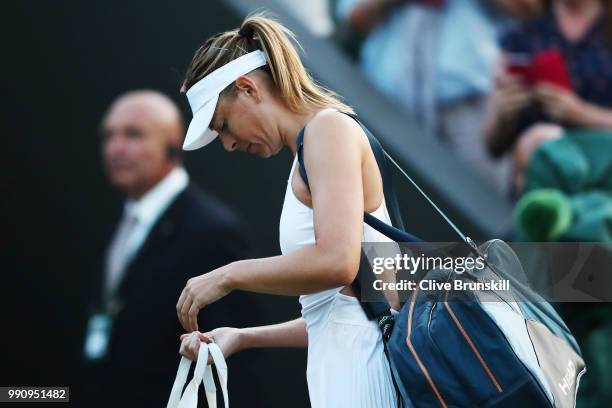 Maria Sharapova of Russia appears dejected after her Ladies' Singles first round match against Vitalia Diatchenko of Russia on day two of the...