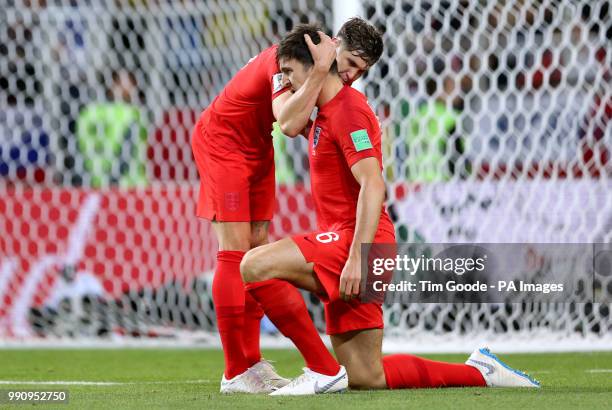 England's John Stones and Harry Maguire hug during the FIFA World Cup 2018, round of 16 match at the Spartak Stadium, Moscow.