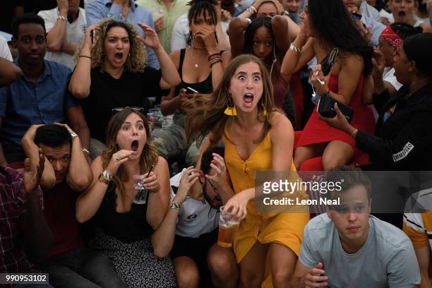England fans react in horror to Colombia's equaliser at the end of extra time as they watch the FIFA 2018 World Cup Finals match between Colombia and...