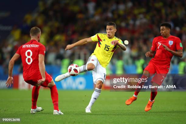 Mateus Uribe of Colombia competes with Jesse Lingard of England during the 2018 FIFA World Cup Russia Round of 16 match between Colombia and England...