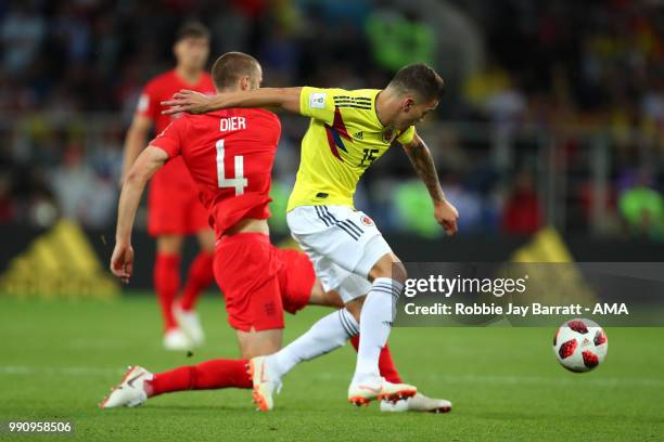 Eric Dier of England competes with Mateus Uribe of Colombia during the 2018 FIFA World Cup Russia Round of 16 match between Colombia and England at...