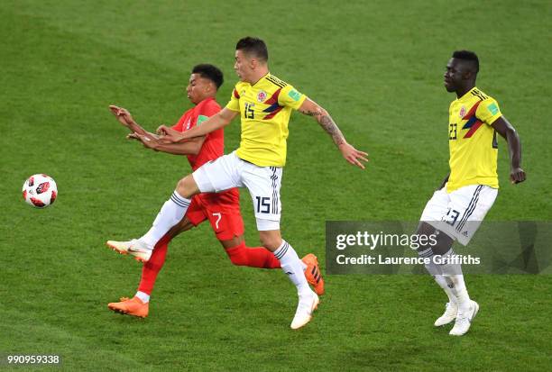 Jesse Lingard of England is challenged by Mateus Uribe of Colombia during the 2018 FIFA World Cup Russia Round of 16 match between Colombia and...