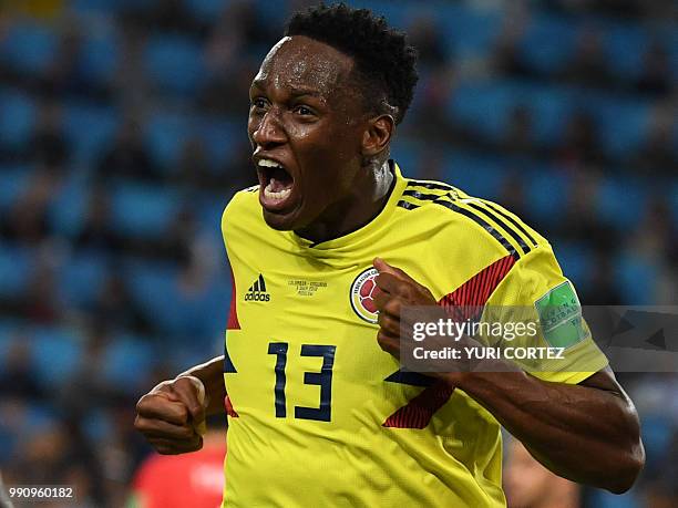 Colombia's defender Yerry Mina celebrates after scoring the equalizer during the Russia 2018 World Cup round of 16 football match between Colombia...